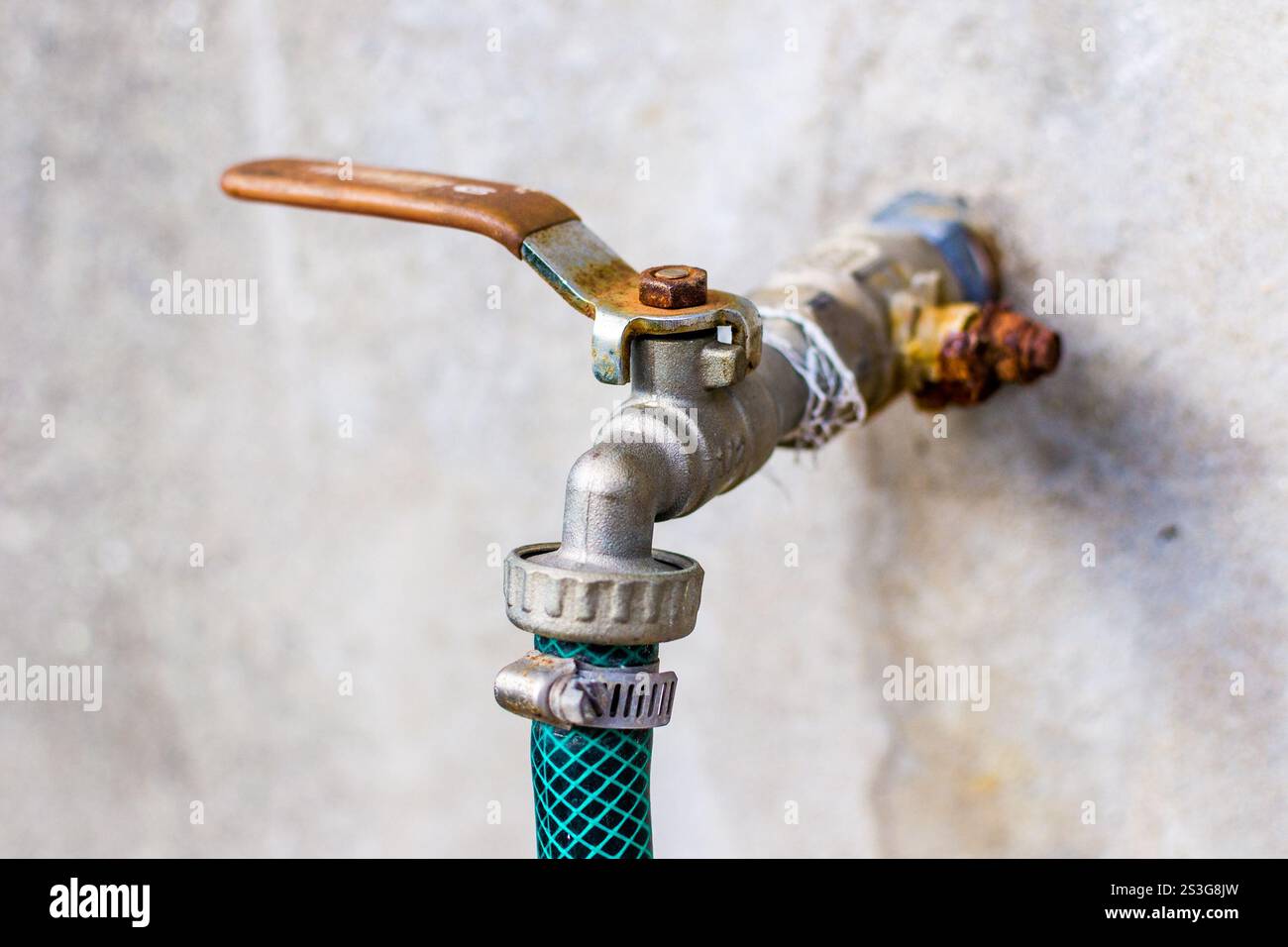 Water tap on the wall Stock Photo