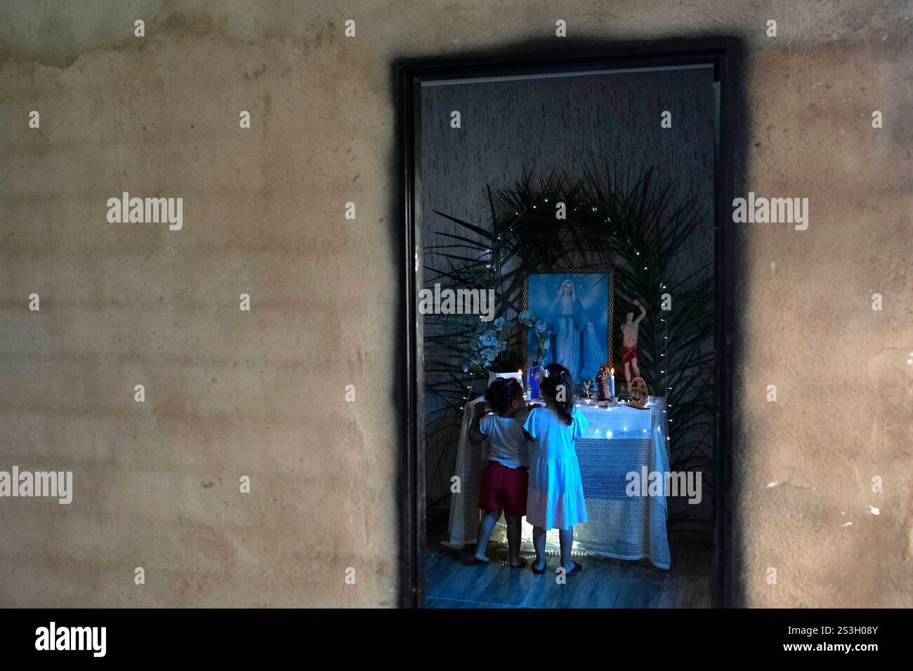 Children look at an Our Lady altar during a procession marking Folia de ...