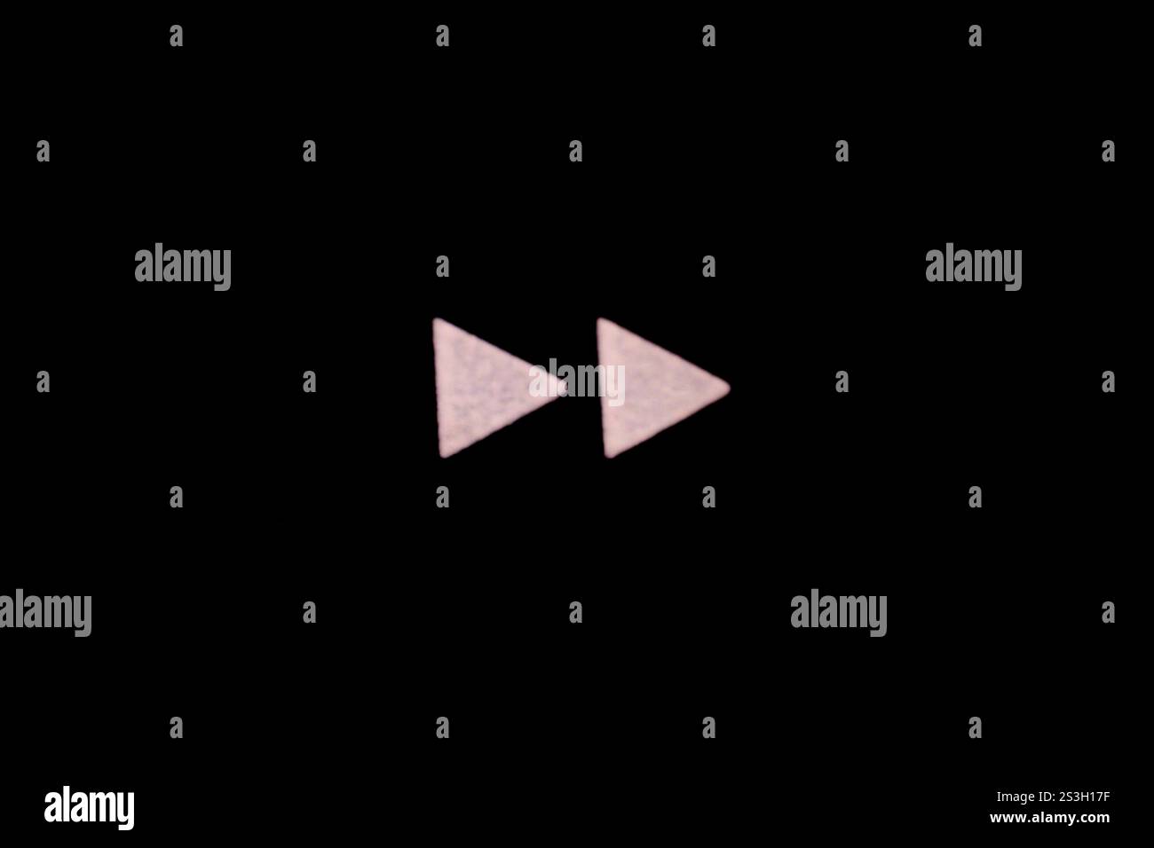 Symbol for advancing to the next track song episode in white with black background Stock Photo