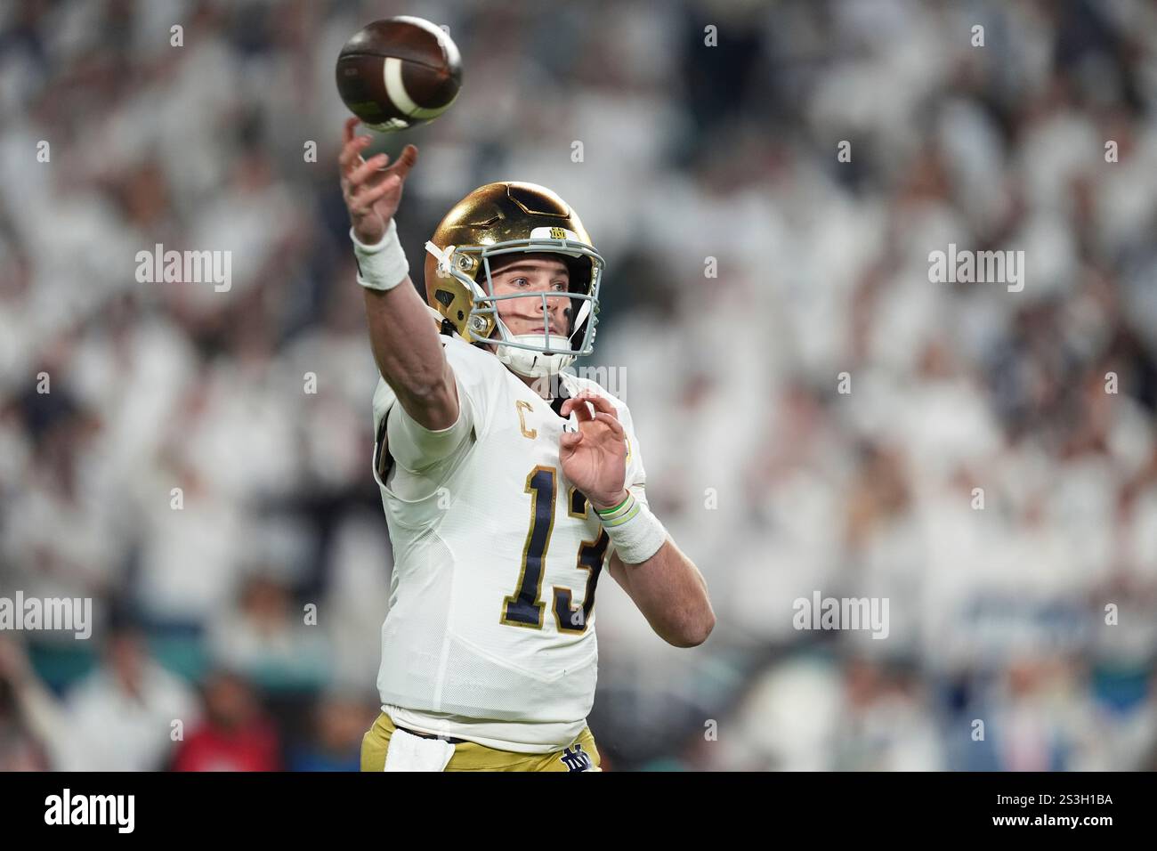 Notre Dame quarterback Riley Leonard (13) aims a pass during first half