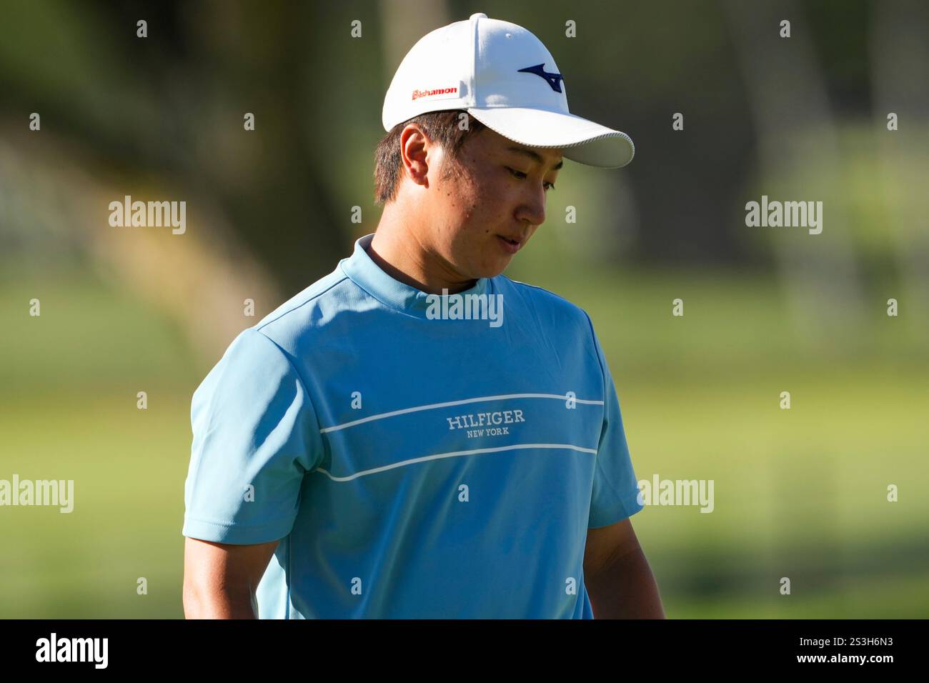 Yuta Sugiura, of Japan, walks on the ninth green during the first round