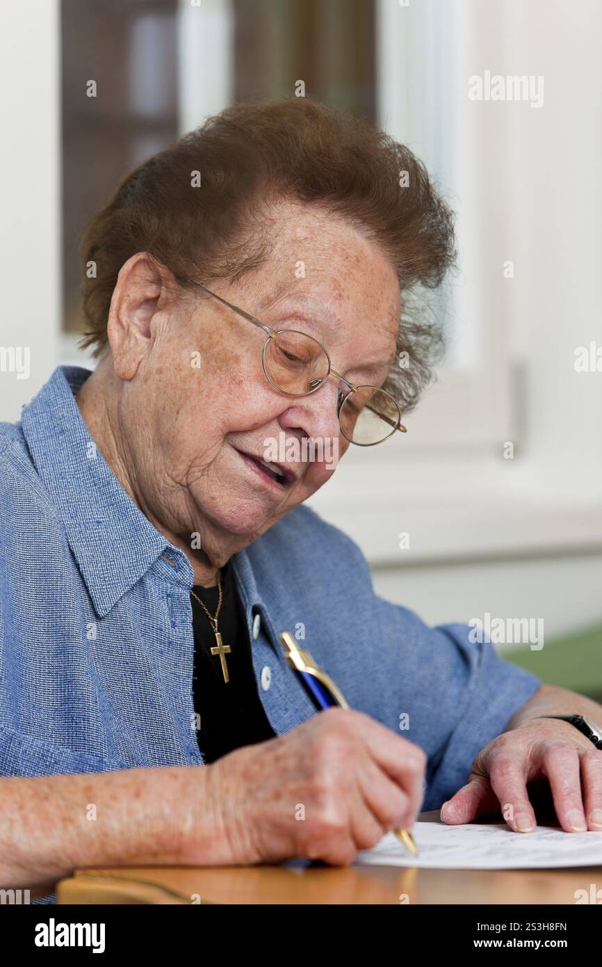 Old woman writes a letter Stock Photo - Alamy