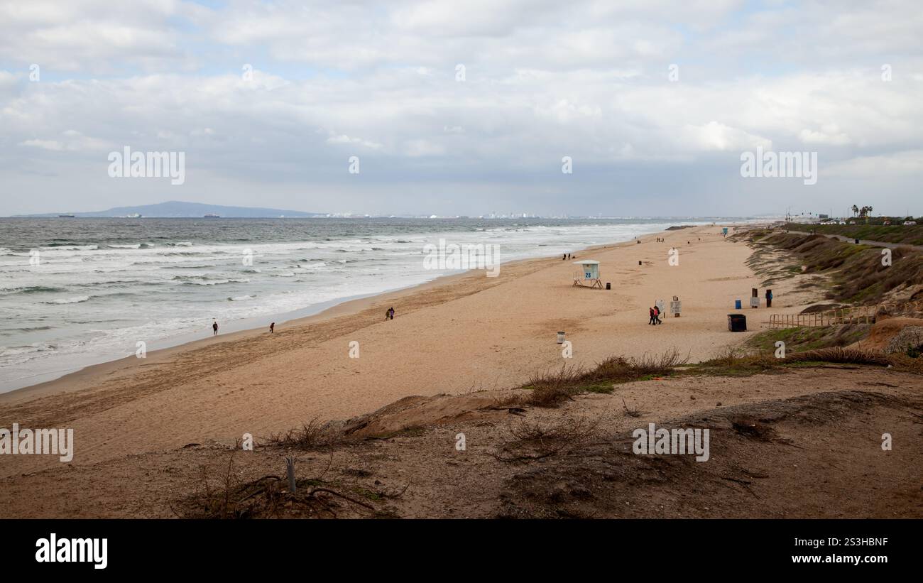 Tranquil beach stretches along coastline hi-res stock photography and ...