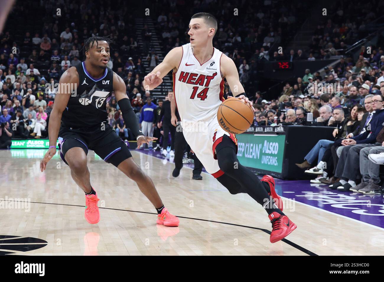 Miami Heat guard Tyler Herro (14) drives to the basket against Utah