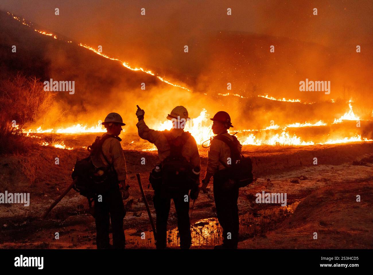 Fire crews battle the Fire in the West Hills section of Los