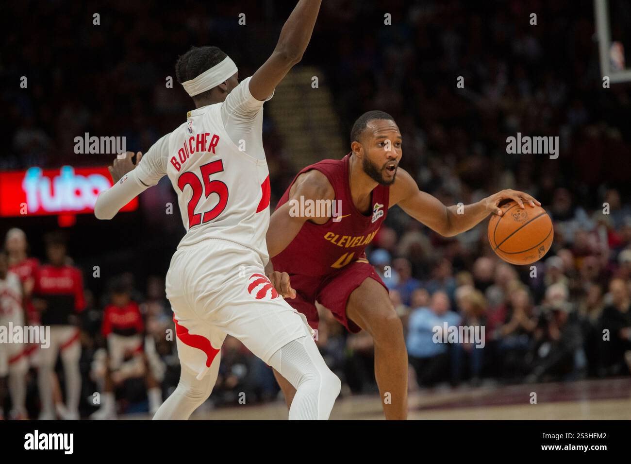 Toronto Raptors' Chris Boucher (25) tries to stop Cleveland Cavaliers