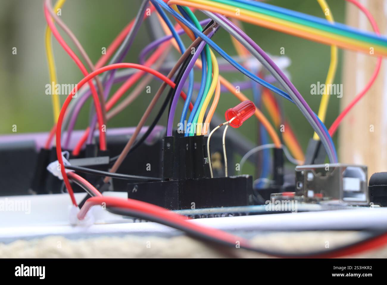 Group of jumper cables connected to breadboard and micro controller as ...