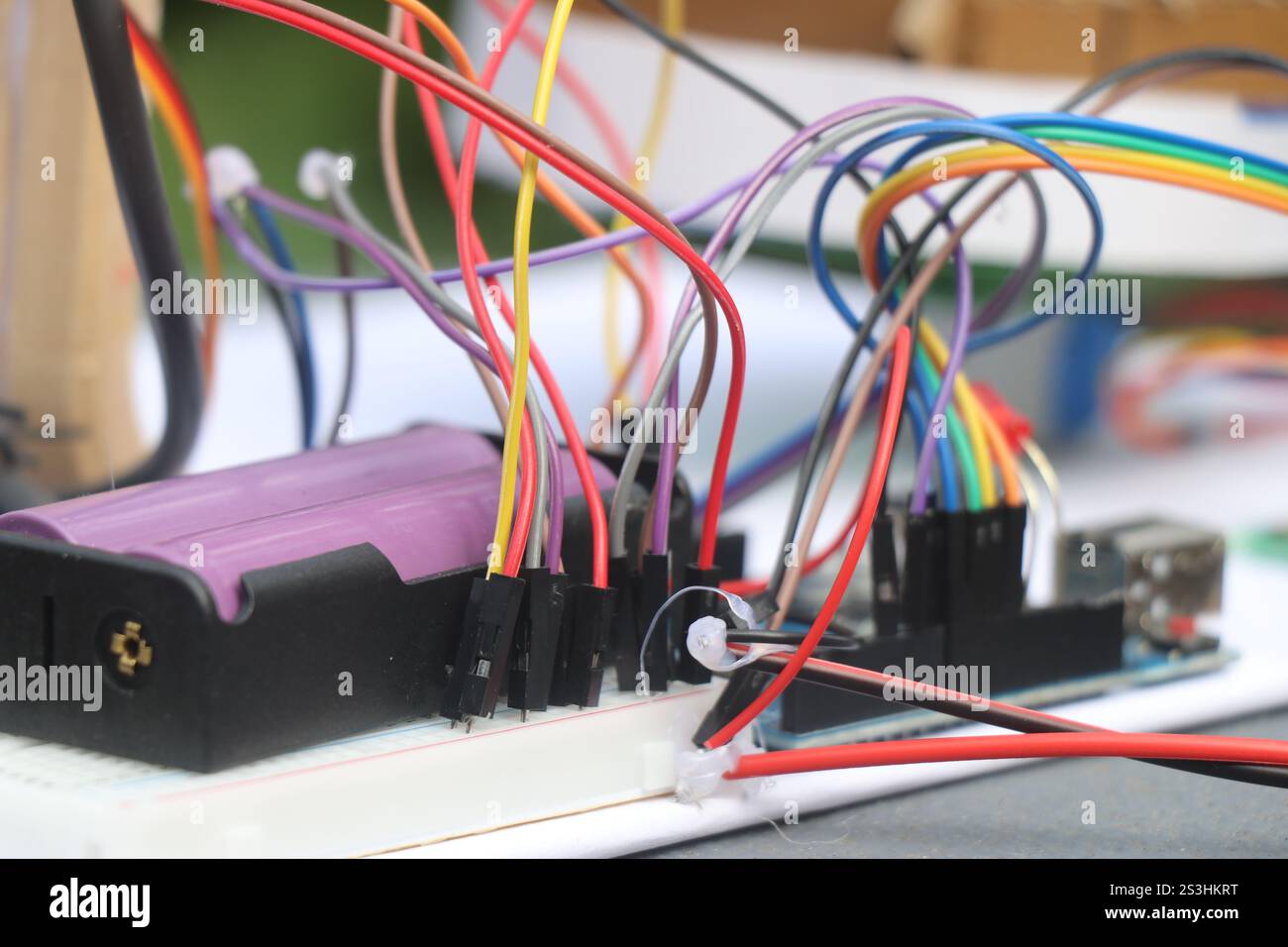 Set of jumper cables connected to micro controller and breadboard with ...