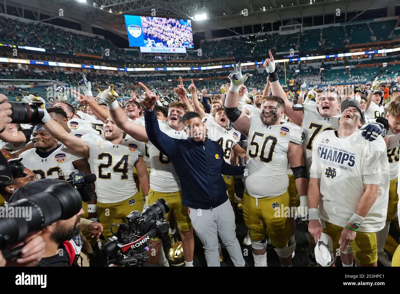 Notre Dame head coach Marcus Freeman an the team sing to fans after