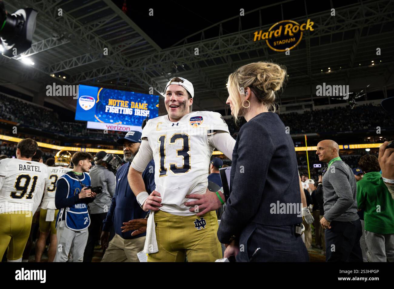 Notre Dame quarterback Riley Leonard (13) is interviewed after winning