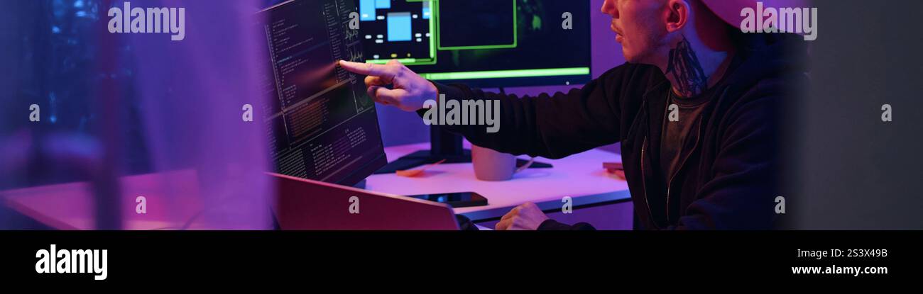 IT Worker Working With Metadata On Computer Stock Photo
