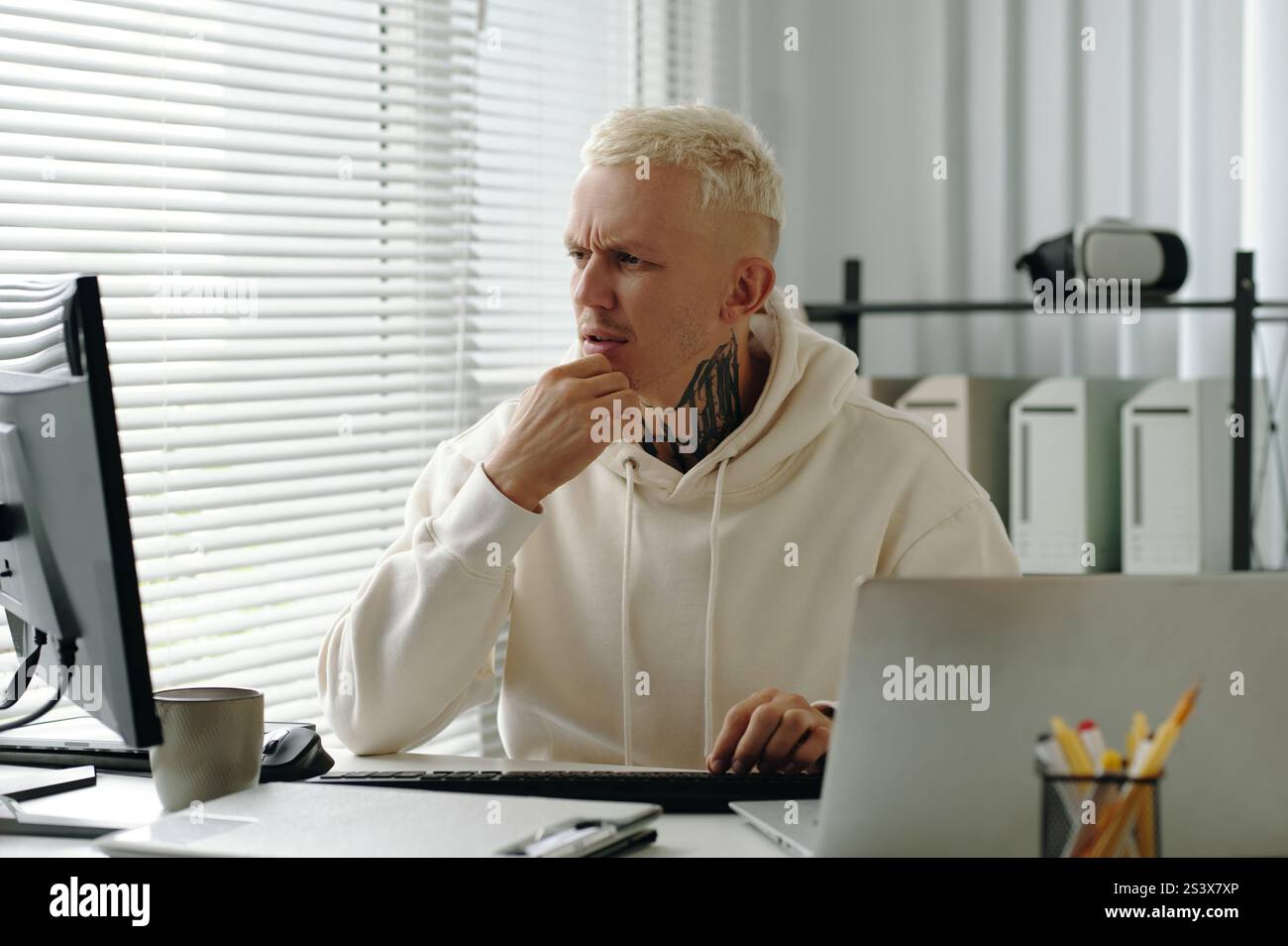 IT Developer Working In Office Stock Photo