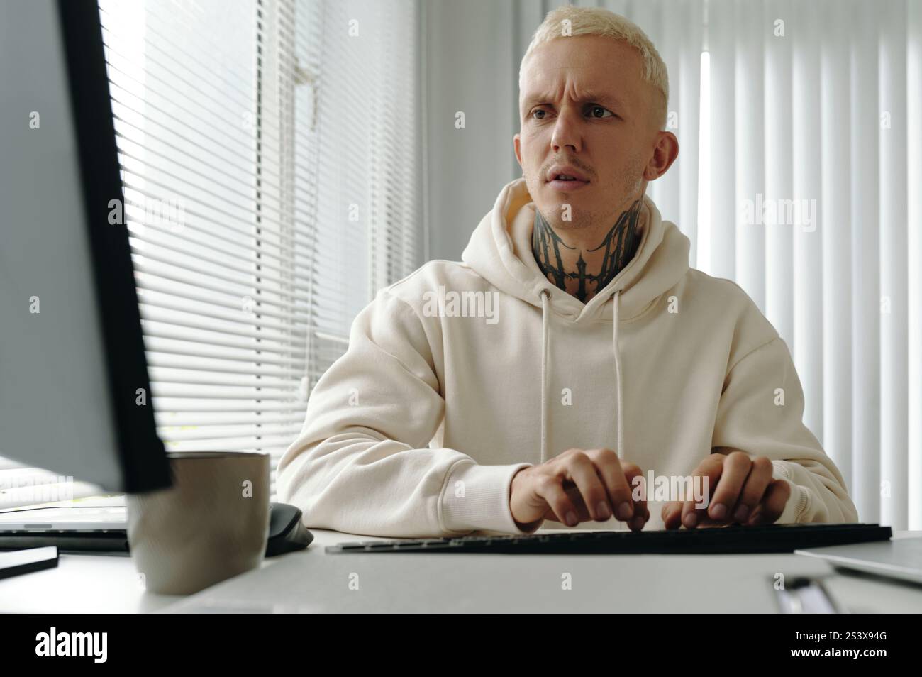 Programmer Typing On Computer In Office Stock Photo