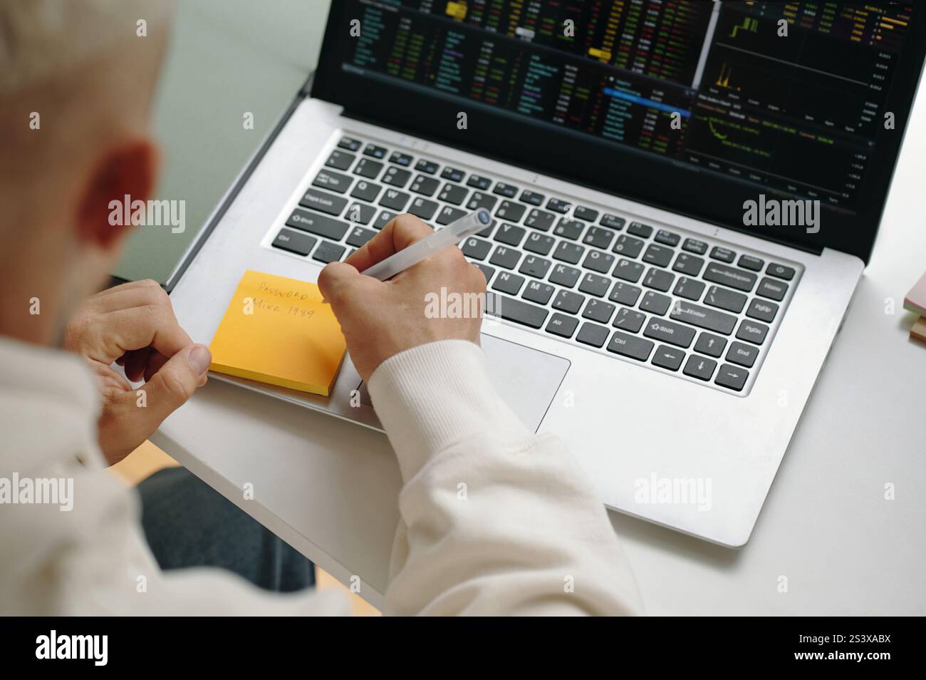 Programmer Writing Password On Note Stock Photo