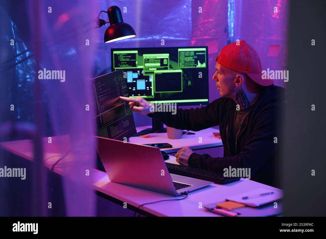 IT Worker Working On Computer With Metadata Stock Photo