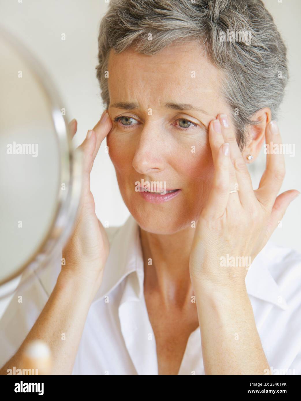 Woman fingers on temples hi-res stock photography and images - Alamy