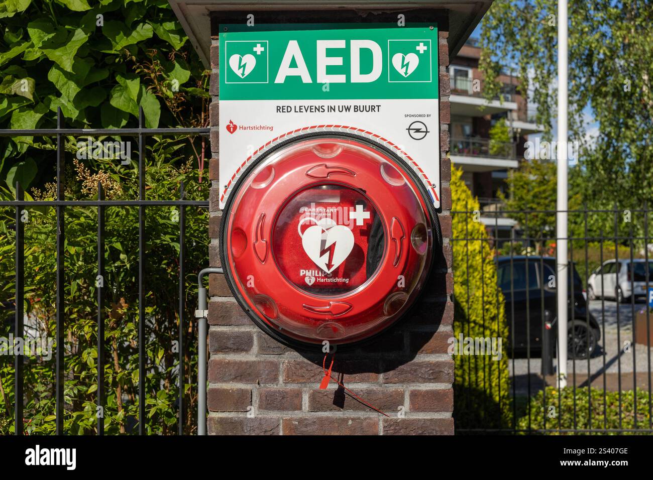Utrecht, the Netherlands. 19 June 2024. City AED mounted on a stone brick wall. An AED, or automated external defibrillator, is used to help those exp Stock Photo