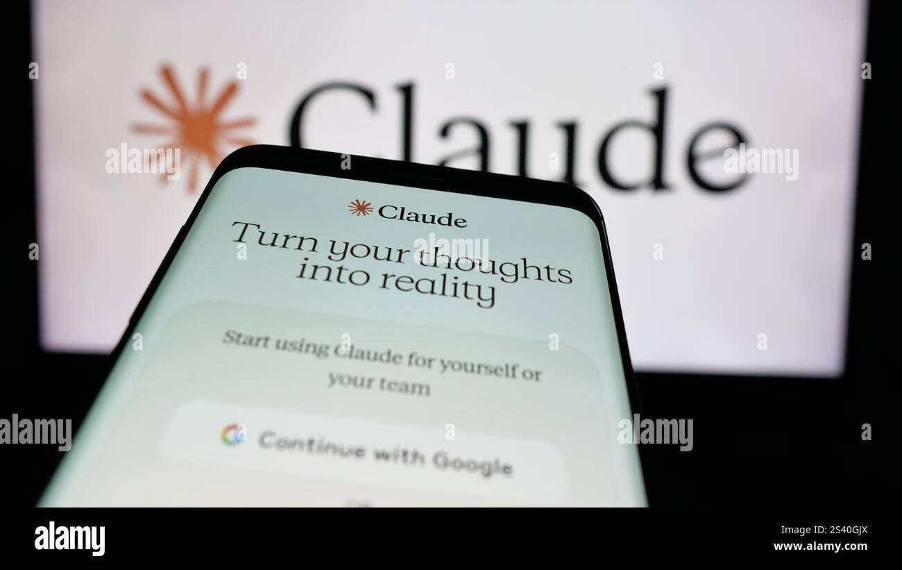 In this photo illustration, a mobile phone with the website of AI model Claude (Anthropic PBC) on screen is seen in front of business logo. Stock Photo