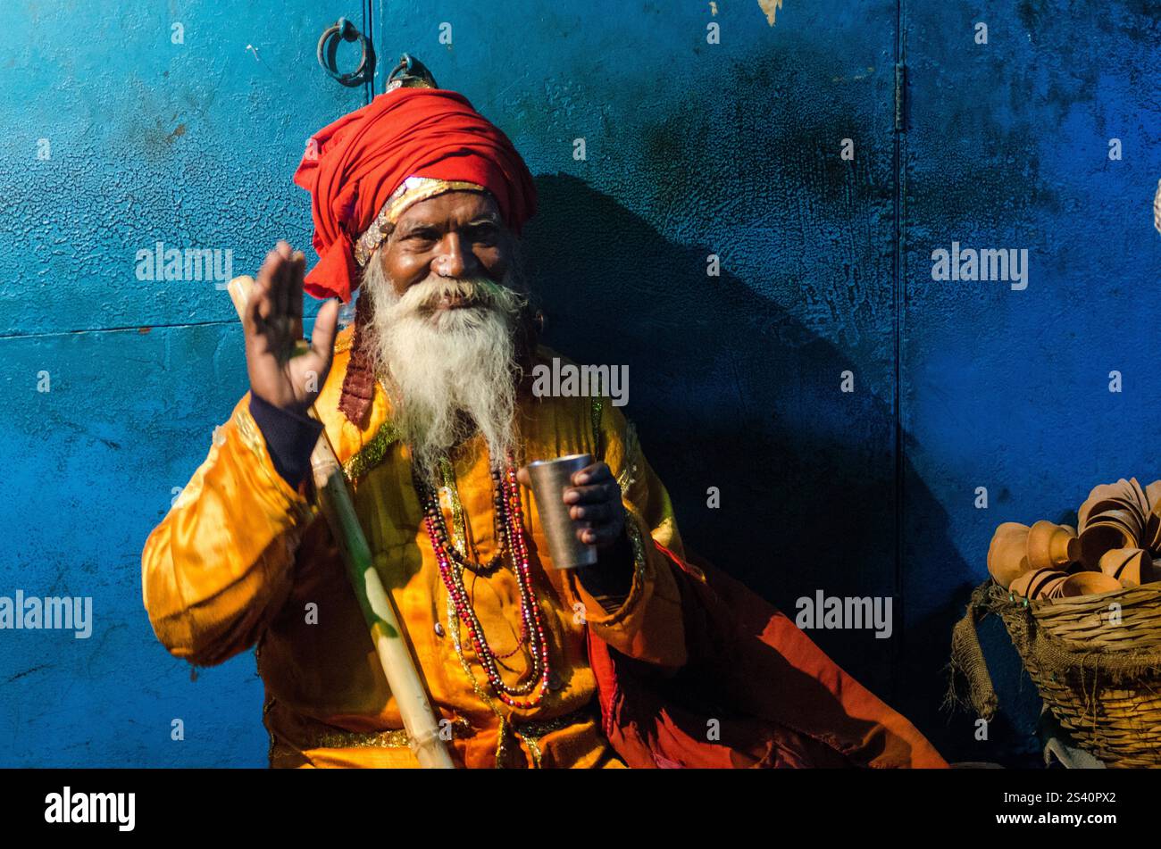 Elderly man in traditional attire at a vibrant cultural festival in ...