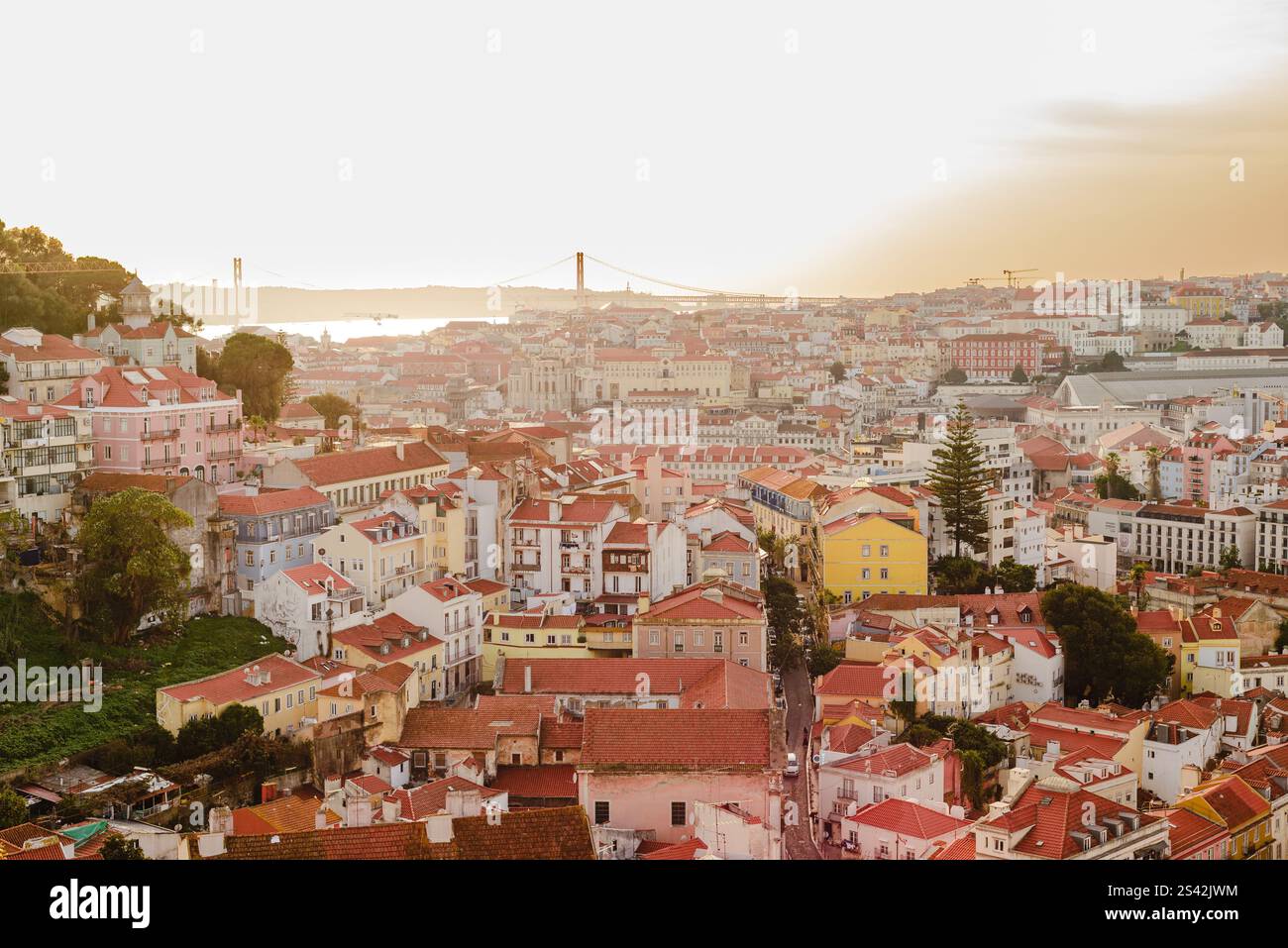 Sunset Over Lisbon's Rooftops and River View Stock Photo