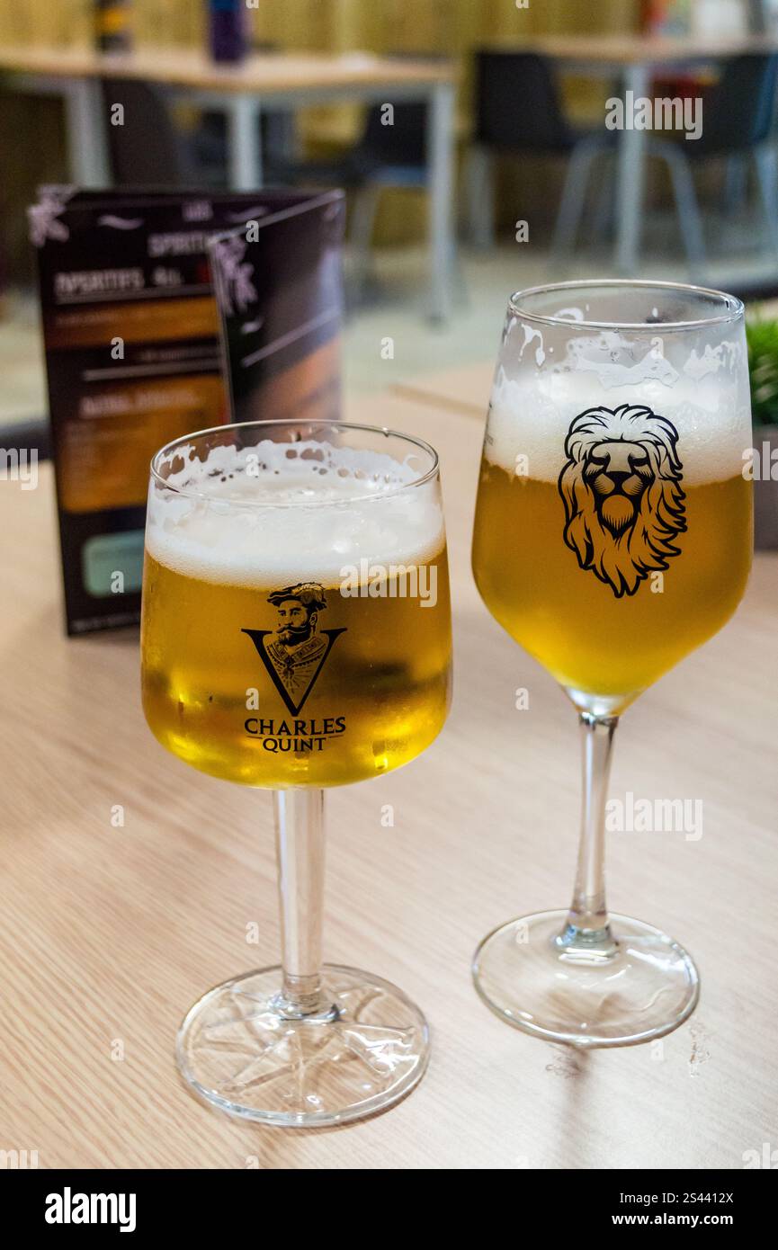 A branded chalice-type glass of Charles Quint blonde beer, Café de la Poste, Bergues, Nord, Hauts de France Stock Photo