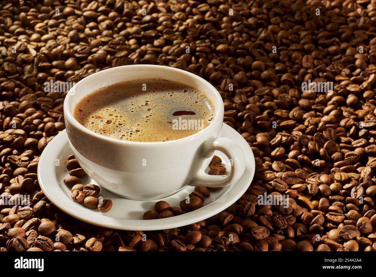Cup of coffee on a background of roasted beans. Selective focus Stock Photo