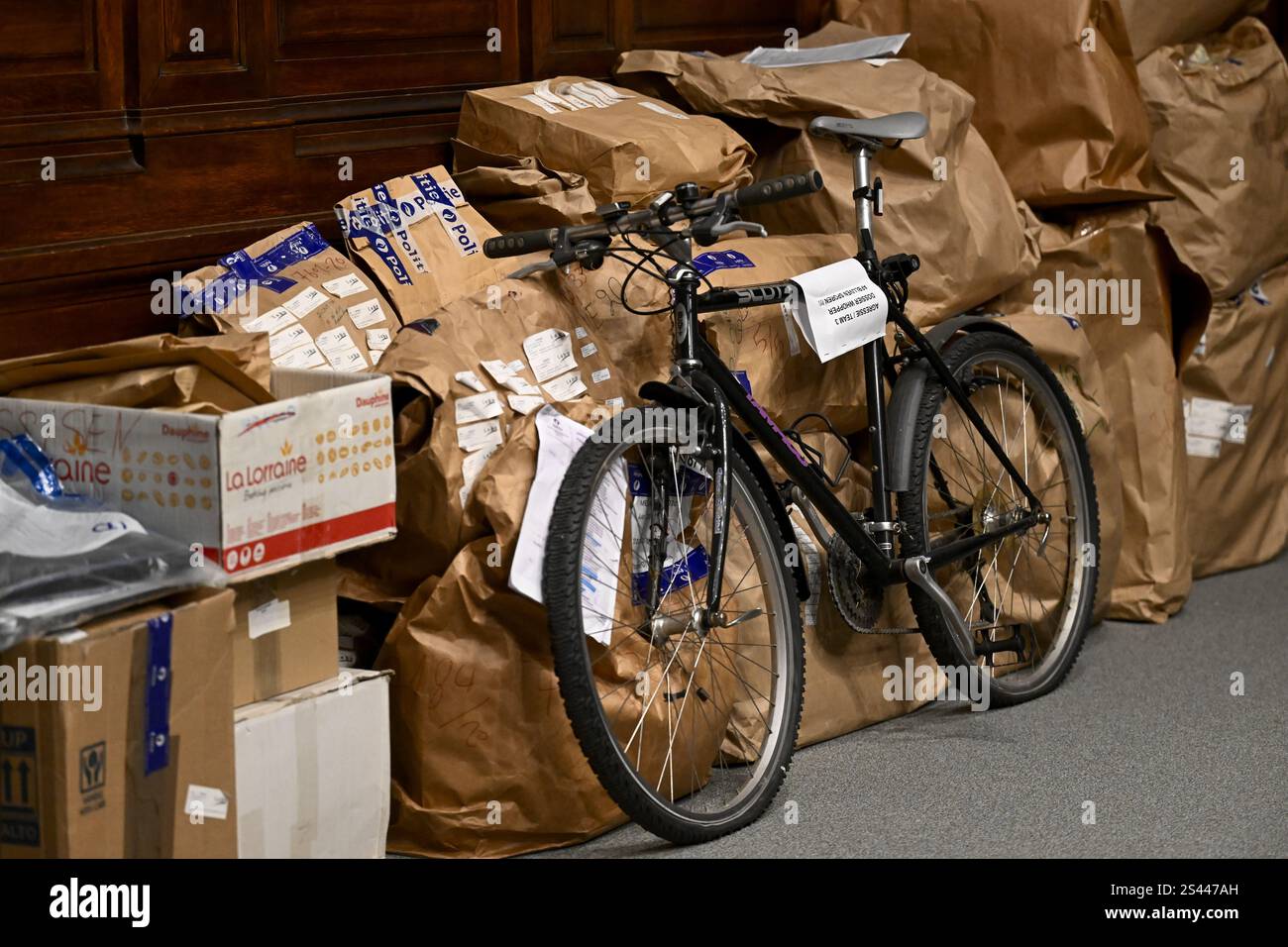 In this Jan. 10, 2020, photo Amelia and Malgorzata Pawulski, from left,  react as their father and husband Richard Pawulski sits up with help from  physical therapist Caitlin Boland and occupational therapist