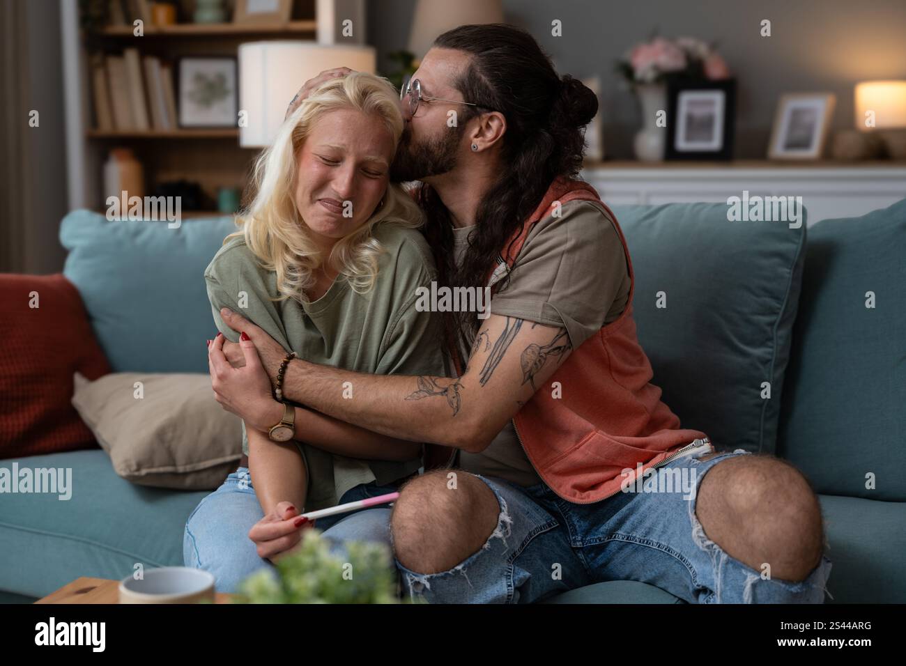 We become parents. Couple feeling happy after taking a home pregnancy ...