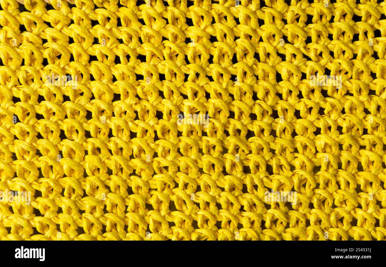 Texture of yellow raffia paper yarn. Crochet bags, clutches, hats ...