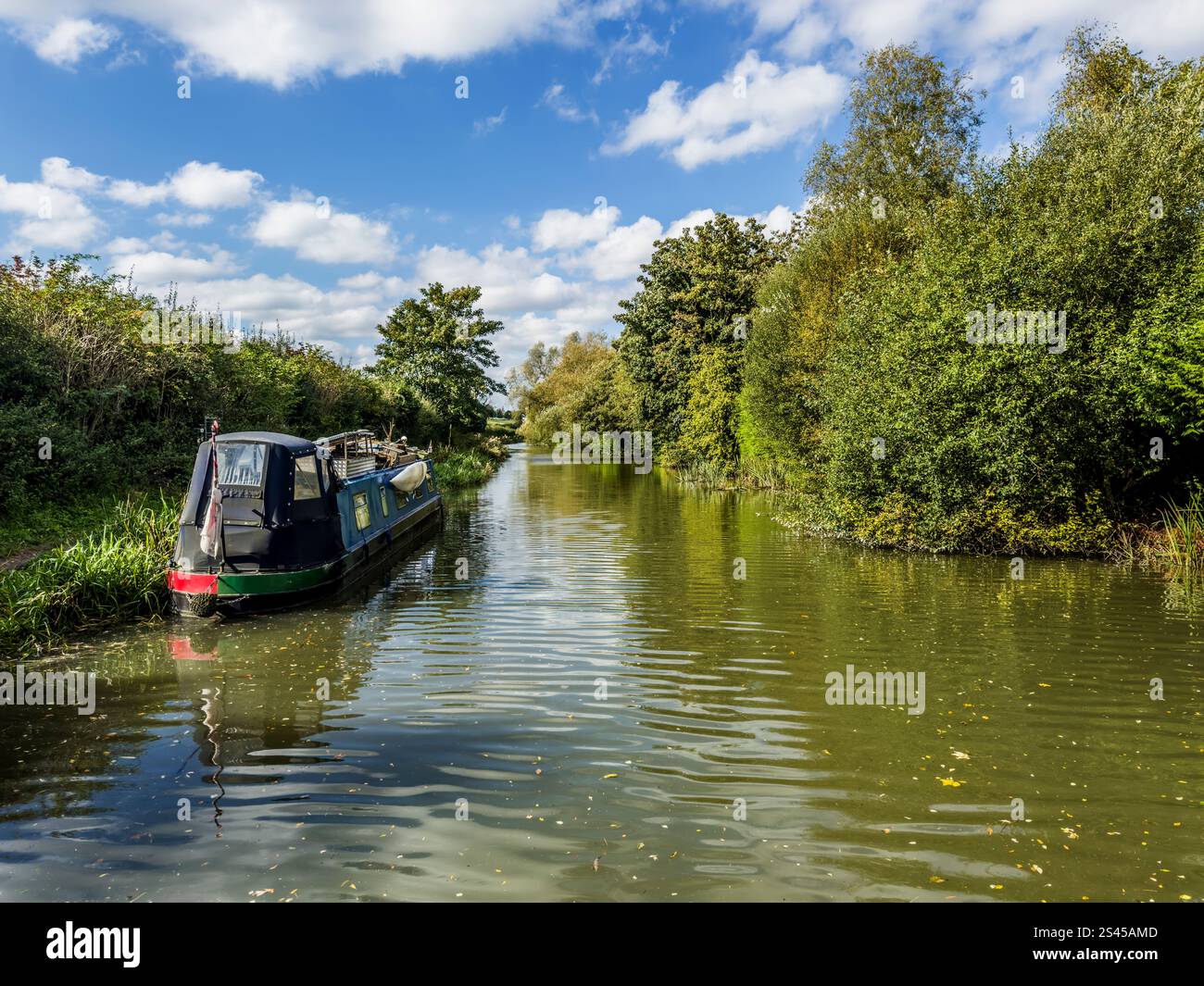 A houseboat along the Kennet and Avon Canal near Hungerford in Berkshire. - Smartphone Captured Stock Image
