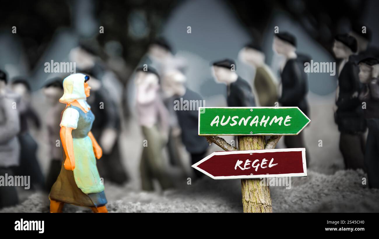 An image with a signpost pointing in two different directions in German. One direction points by exception, the other points by rule. Stock Photo