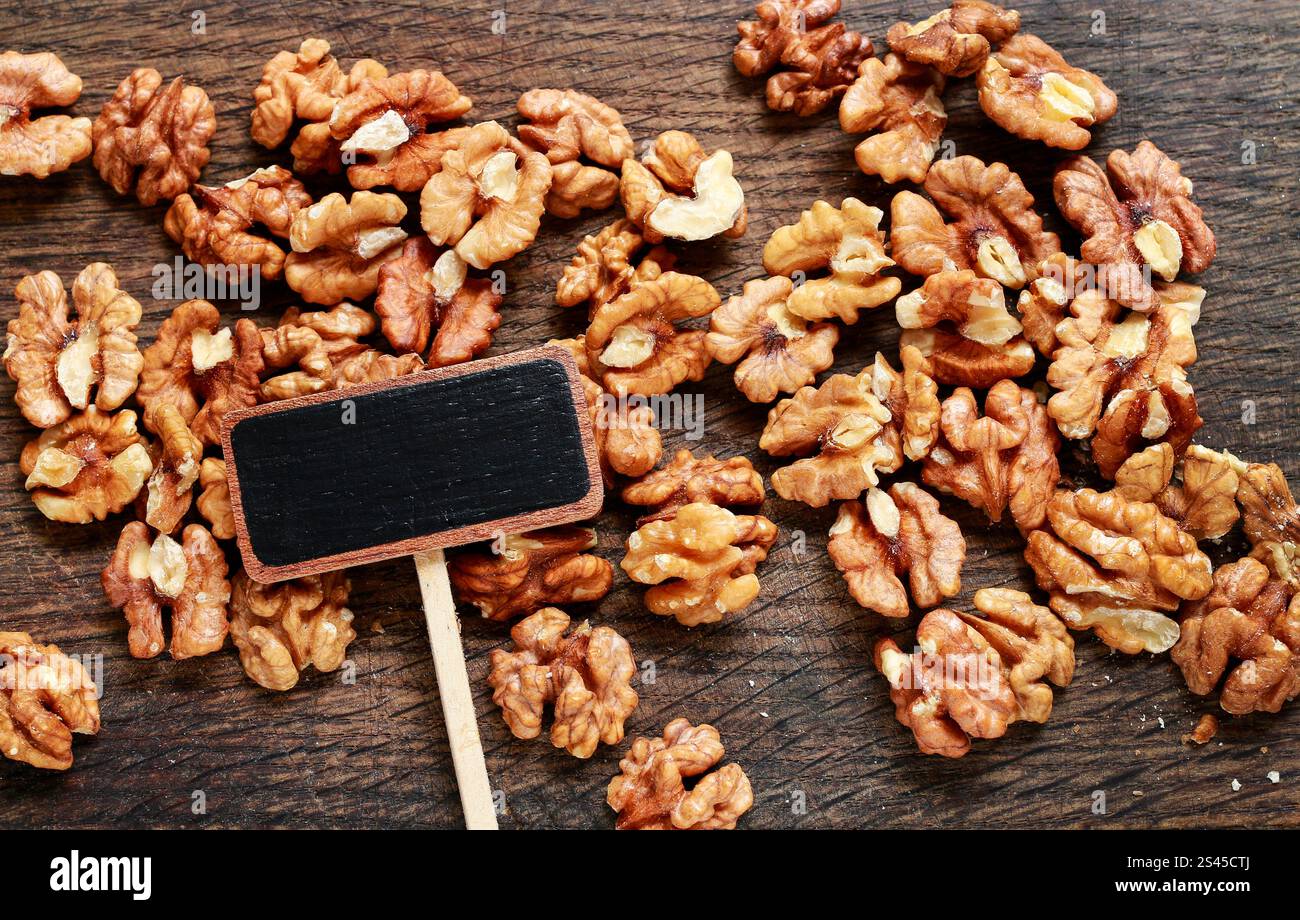 Walnuts and blank blackboard label, healthy food Stock Photo