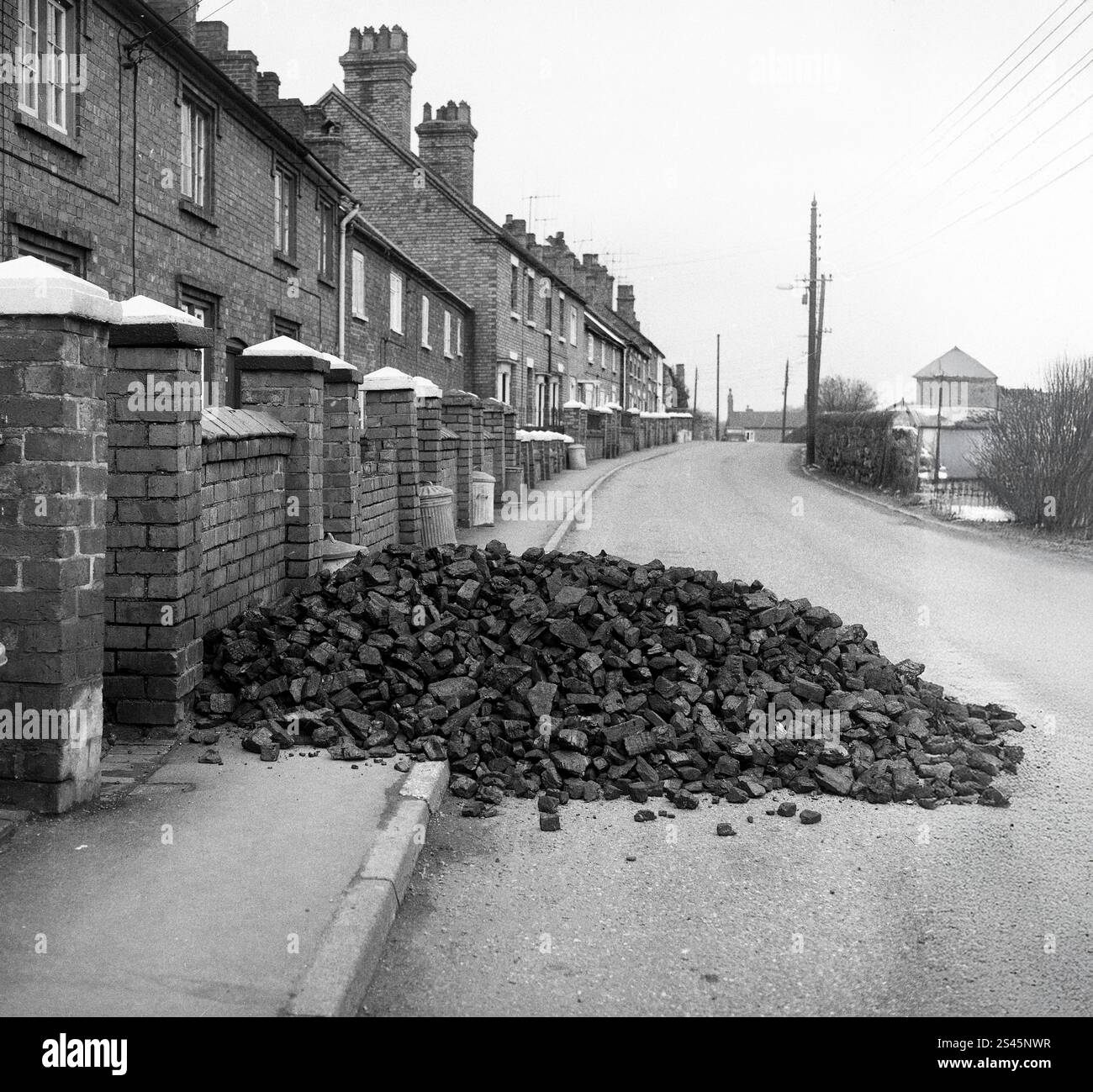 Free miners coal delivery dropped outside houses in Court Street, Madeley, Telford, Shropshire in 1968 Stock Photo