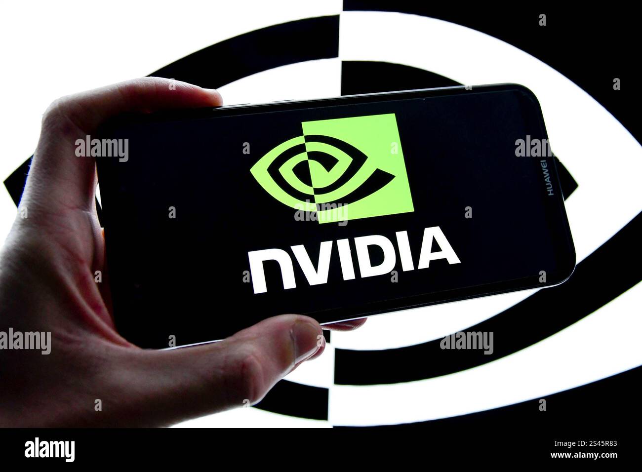 In this photo illustration, the Nvidia company logo is seen displayed ...