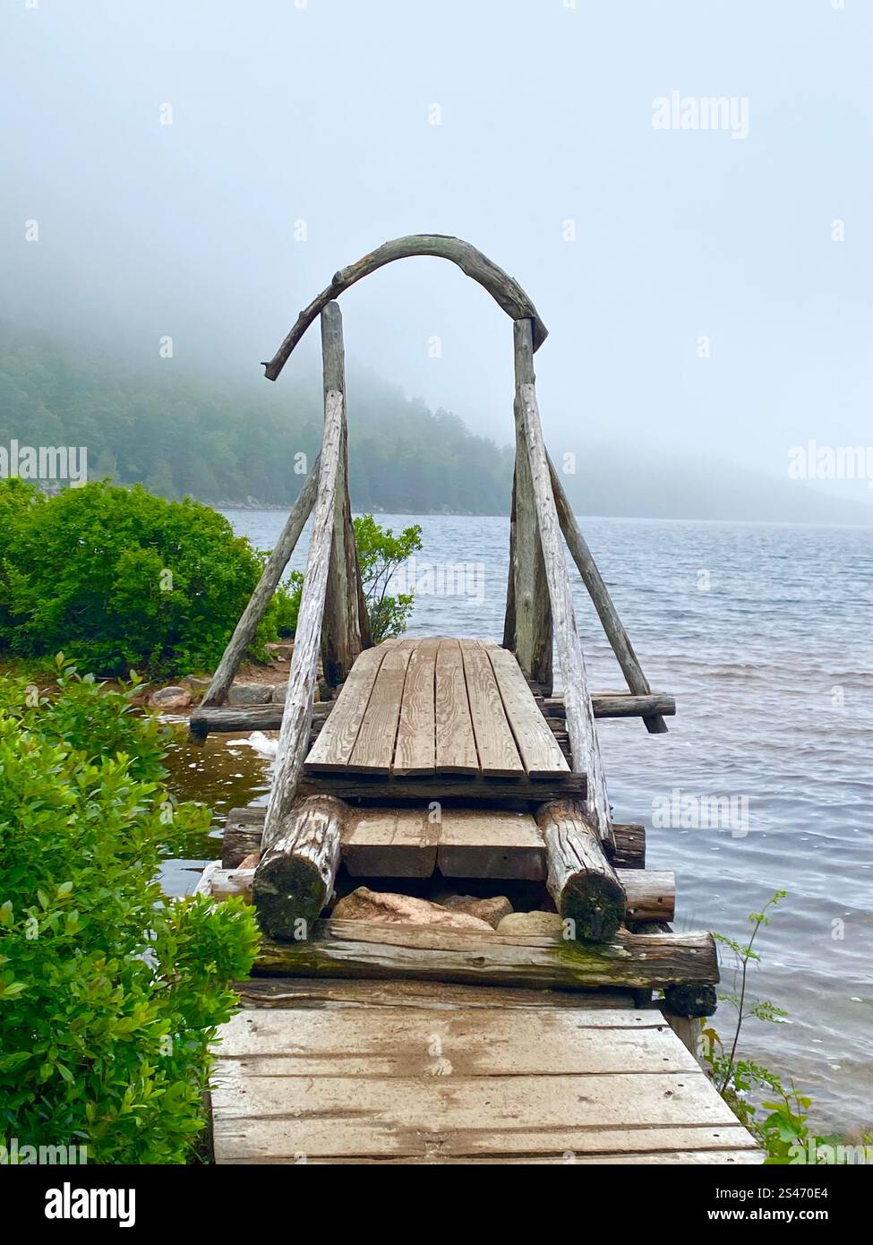 A footbridge on a foggy day Stock Photo - Alamy