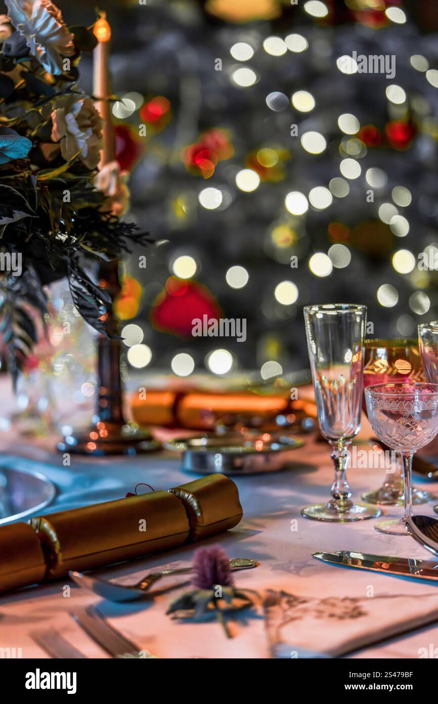Elegant Holiday Season Table Setting with Festive Decorations and Bokeh Lights Stock Photo