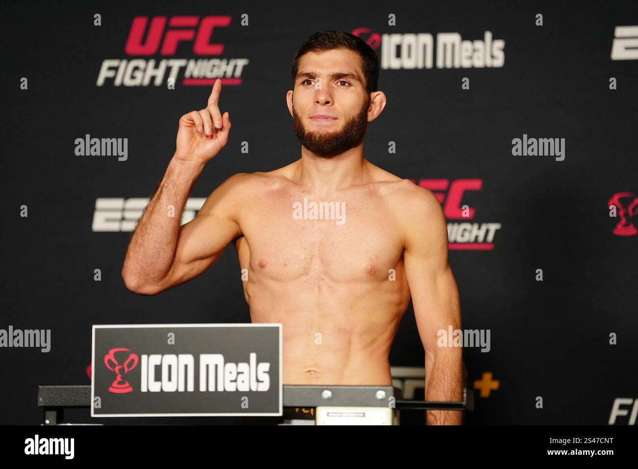 LAS VEGAS, NV JANUARY 10 Nurullo Aliev steps on the scale for the