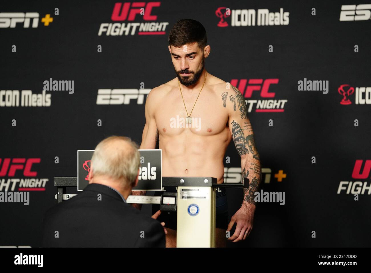 LAS VEGAS, NV JANUARY 10 Joe Solecki steps on the scale for the