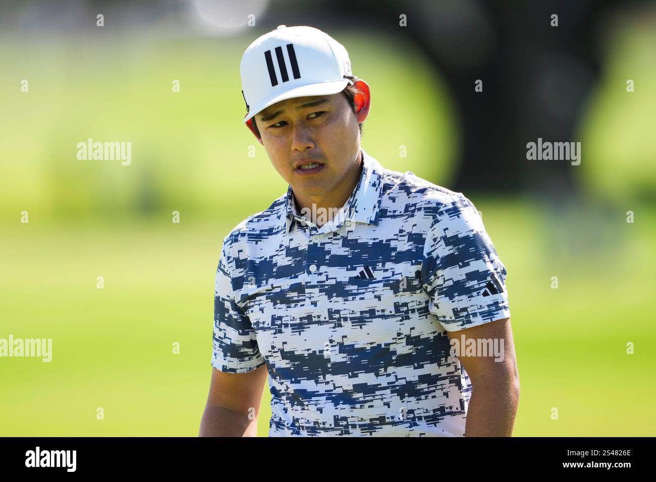 Kaito Onishi, of Japan, walks on the third hole during the second round