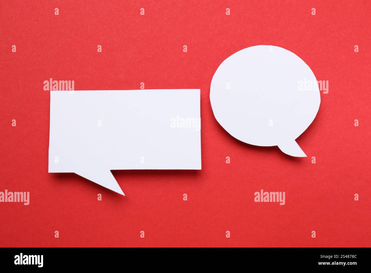 Blank speech bubbles on red background. Space for text Stock Photo