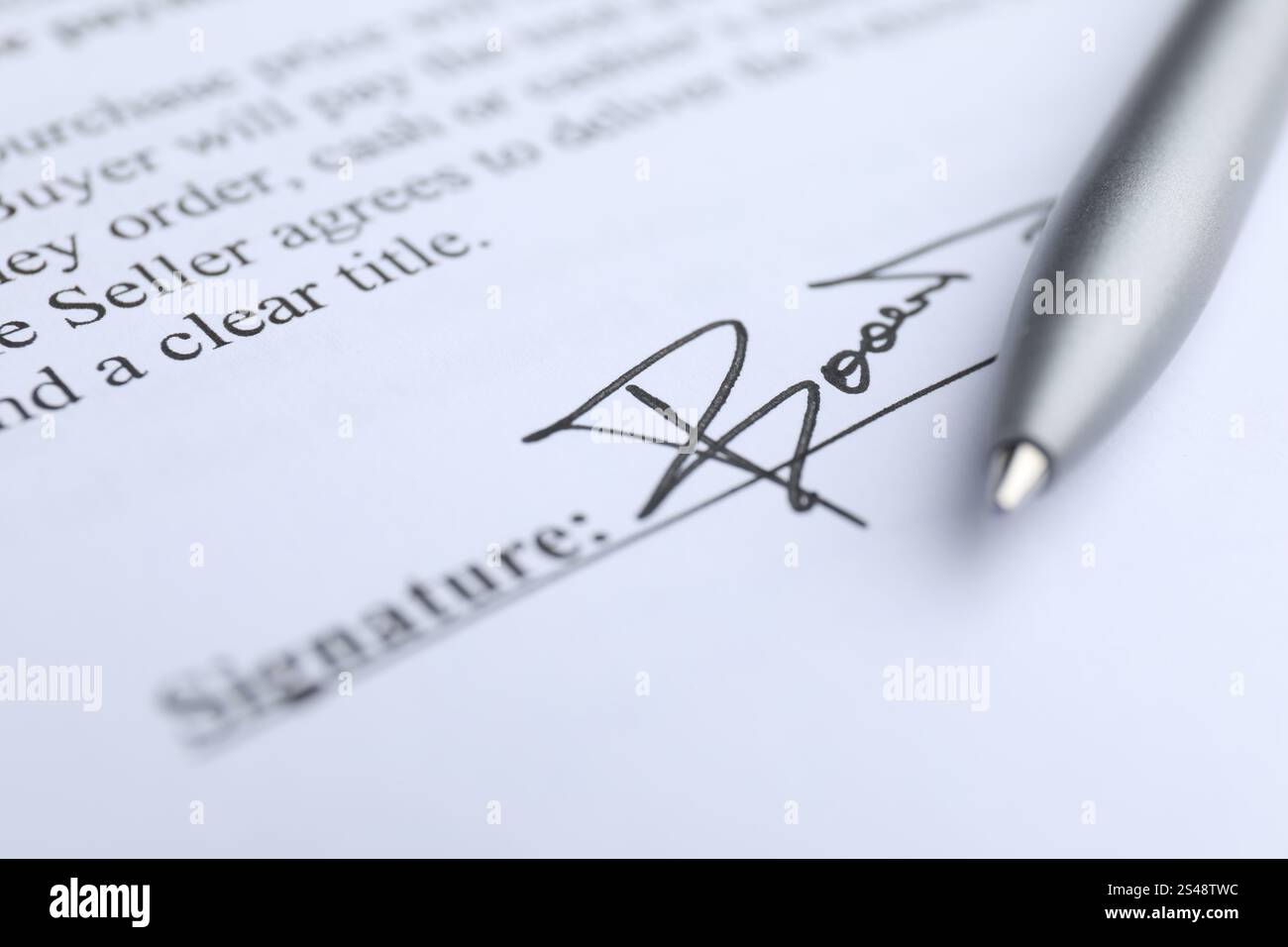 Ballpoint pen and signature on contract, closeup Stock Photo - Alamy