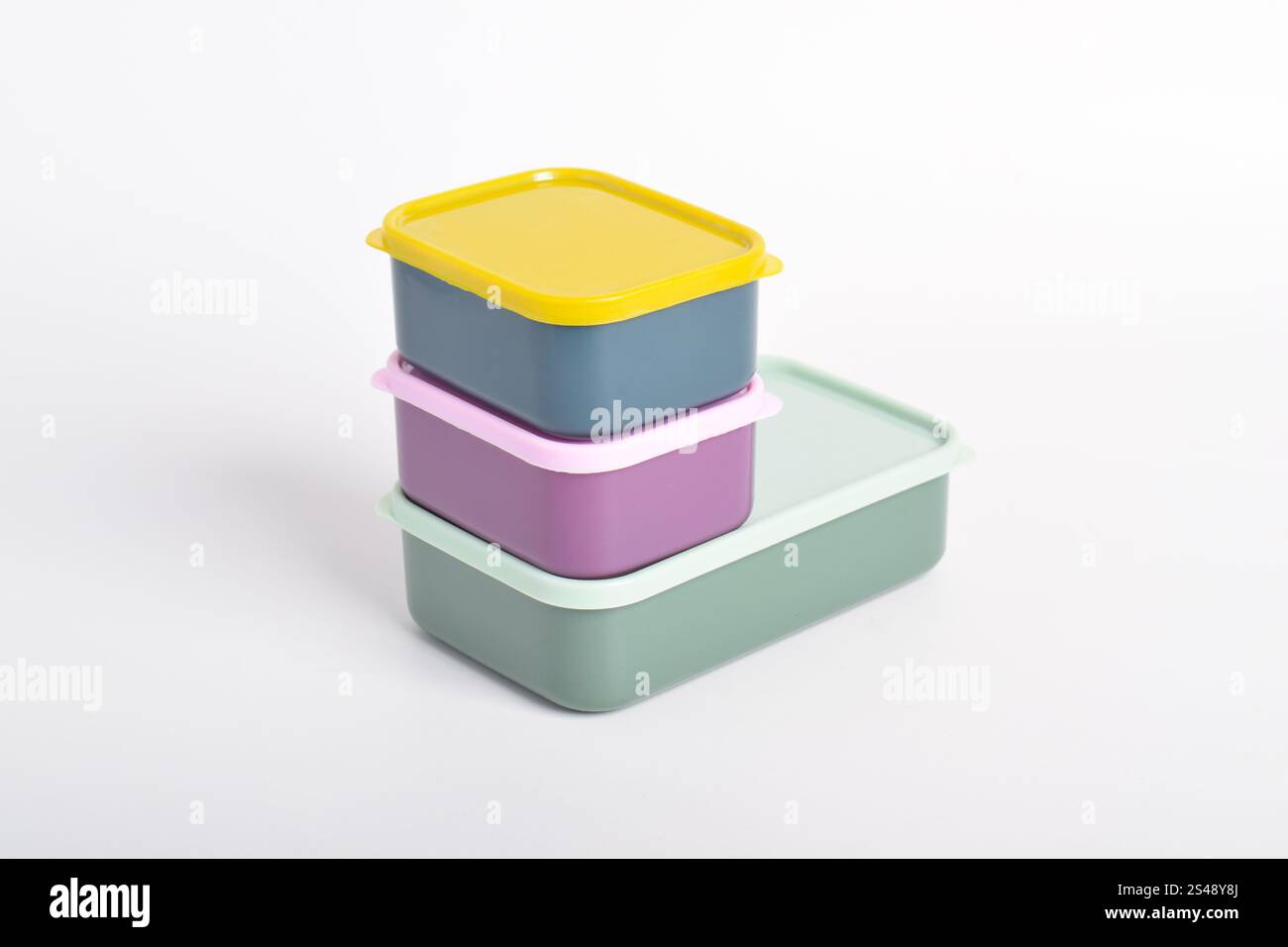 Three colorful Lunch Boxes isolated on white background. Plastic food containers Stock Photo