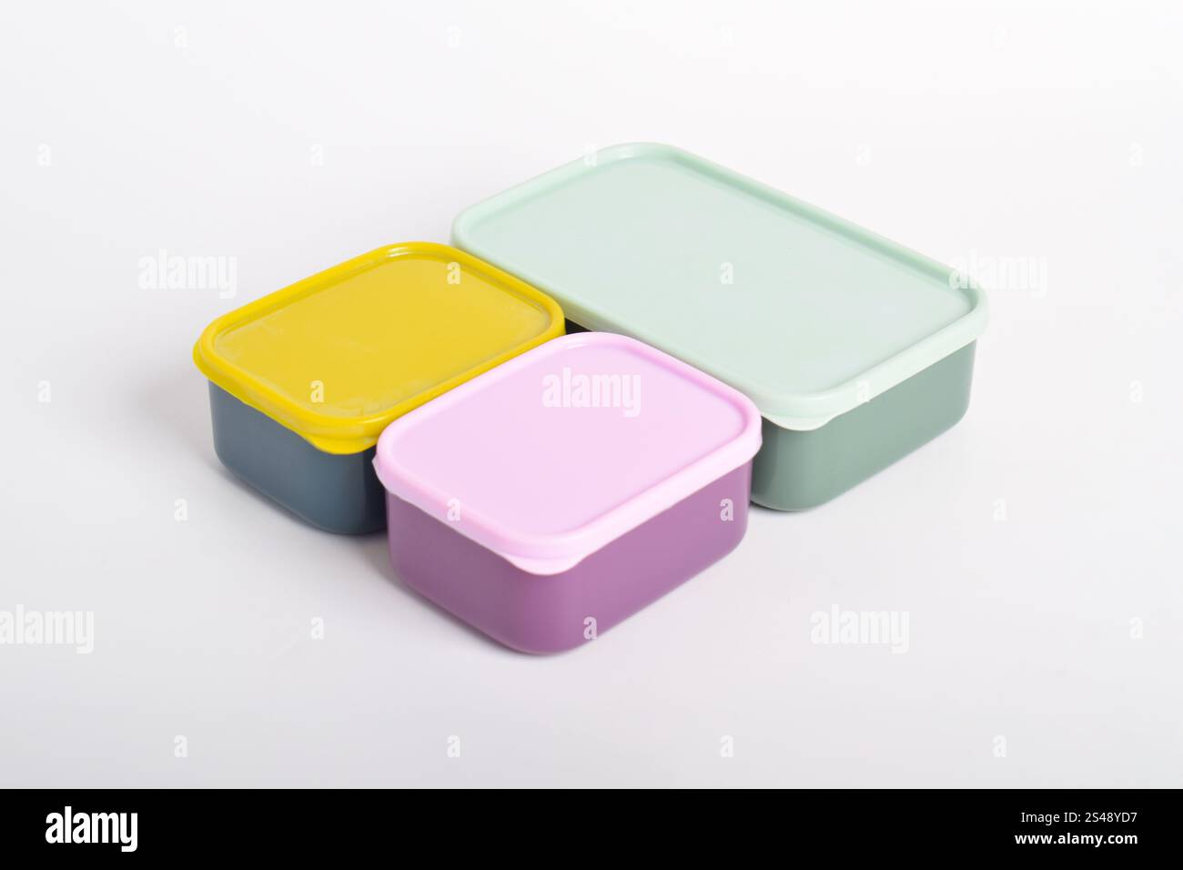 Three colorful Lunch Boxes isolated on white background. Plastic food containers Stock Photo