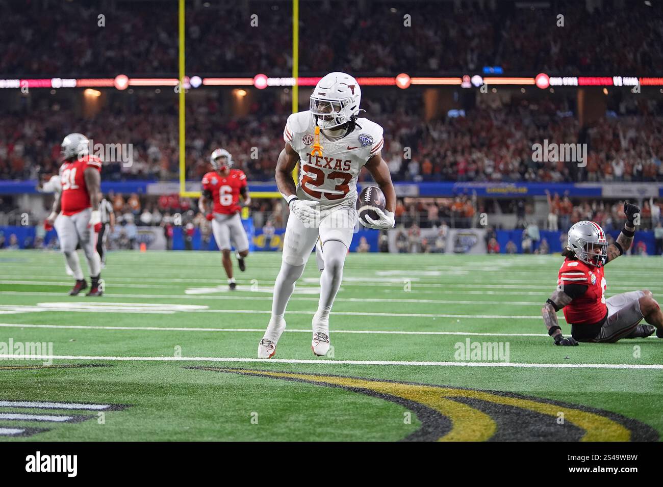 Texas running back Jaydon Blue (23) scores against Ohio State during