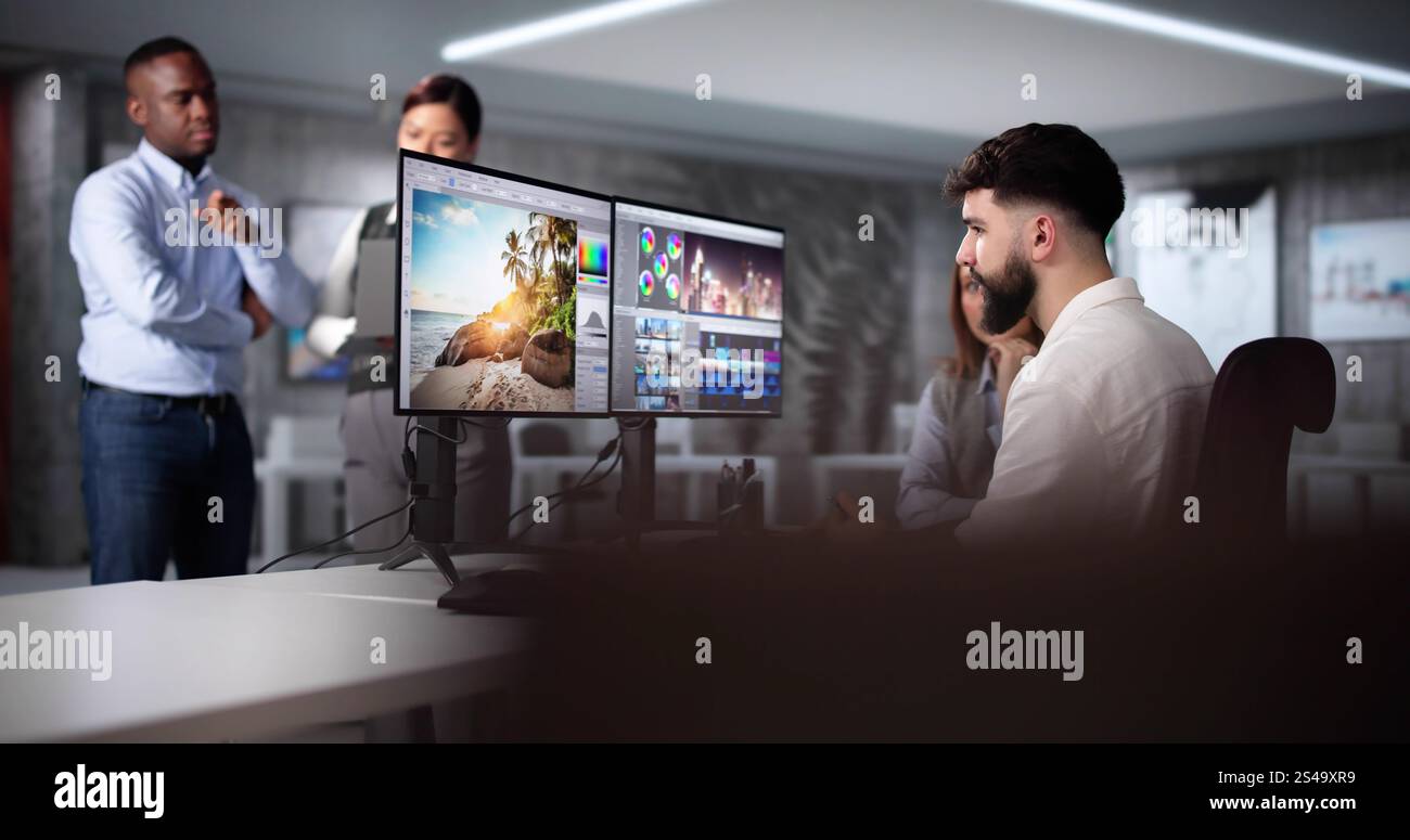 Graphic Designer Artist Team Working On Multiple Computer Screens Stock Photo