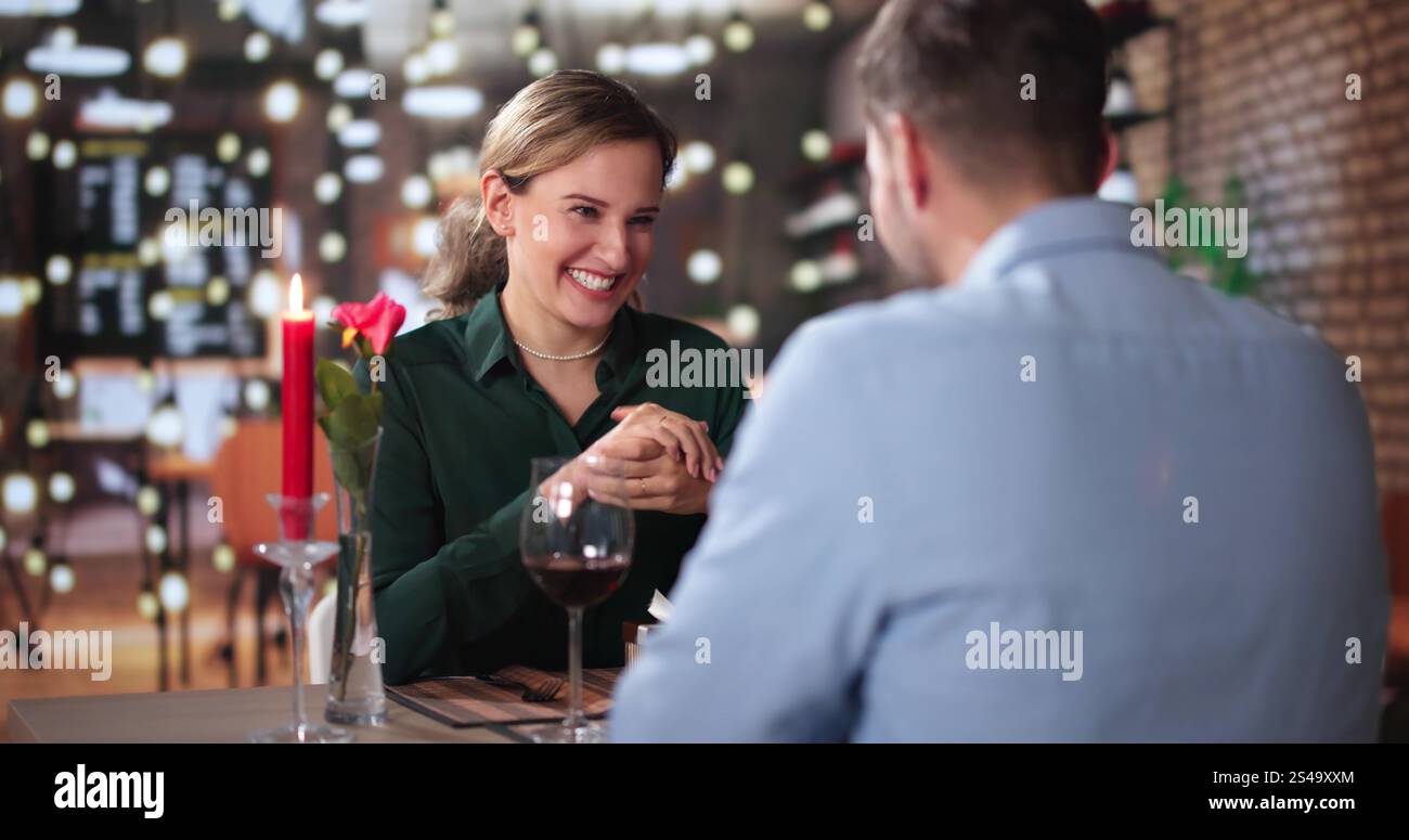 Romantic Couple Having Dinner At The Restaurant Stock Photo