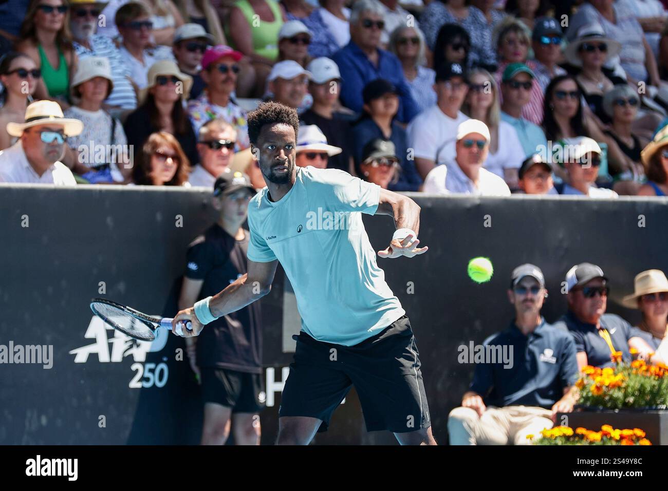 Gael Monfils of France plays a shot against Zizou Bergs of Belgium in