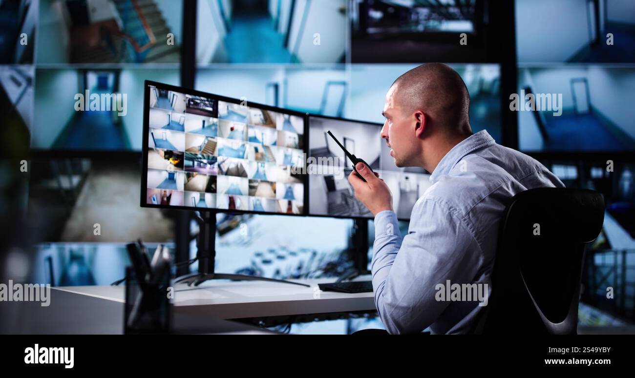 Security System Cctv Monitor Room. Man Using Walkie Talkie Stock Photo ...
