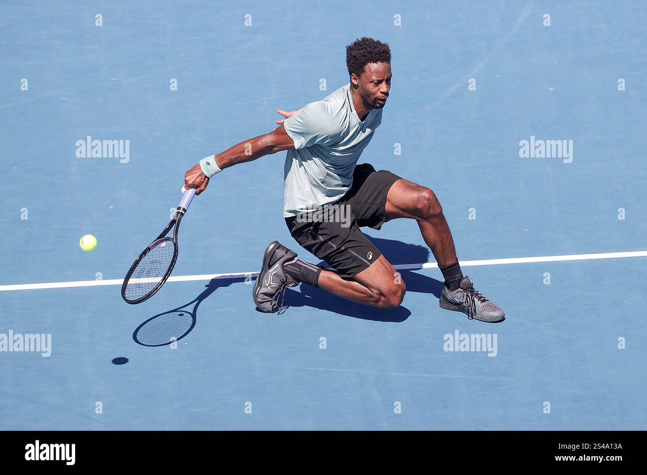 Gael Monfils of France plays a shot against Zizou Bergs of Belgium in