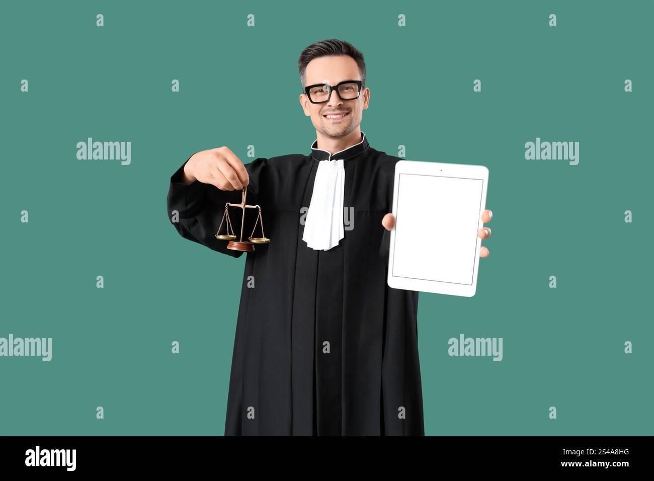 Justice Tablet Male judge with tablet computer and scales of justice on green ...